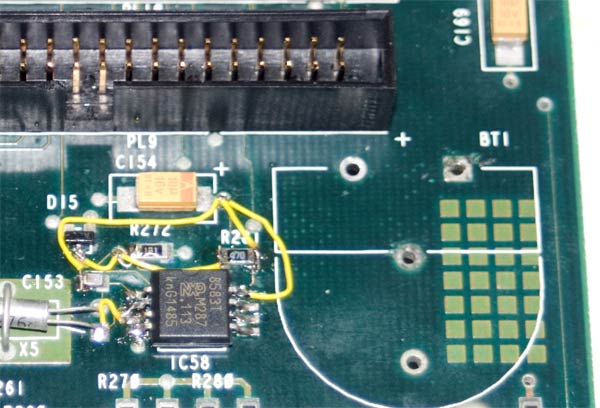 A wide shot of the repaired circuit showing the new IDE connector and wiring to replace the fault tracks.